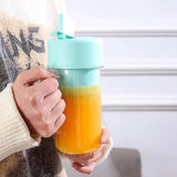 Portable rechargeable juice blender with straw.