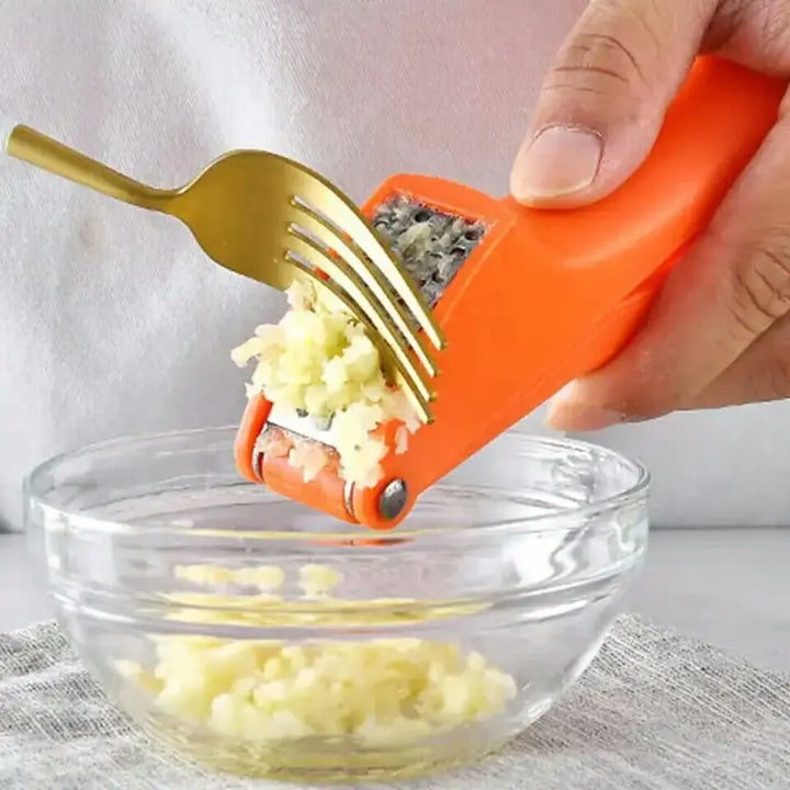 Garlic hand press